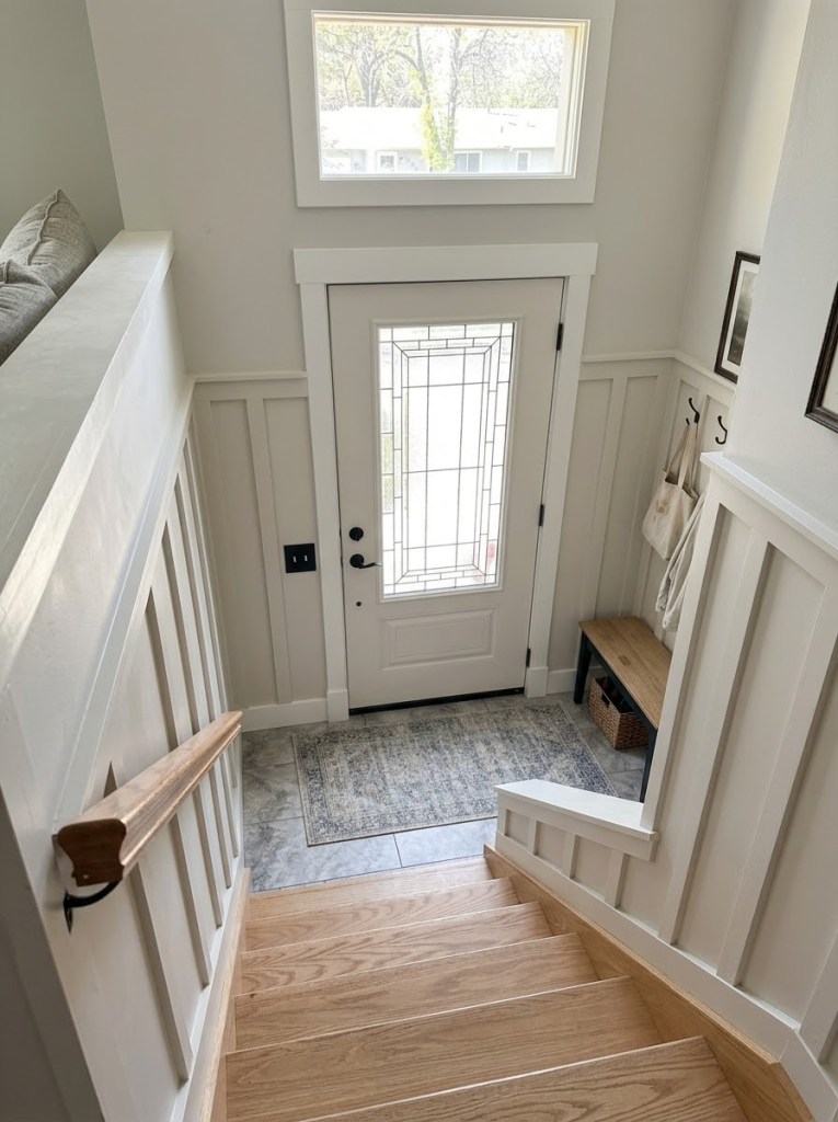 AI rendering of the entry landing viewed from the stairs, showing the board and batten paneling continuing up the stair wall